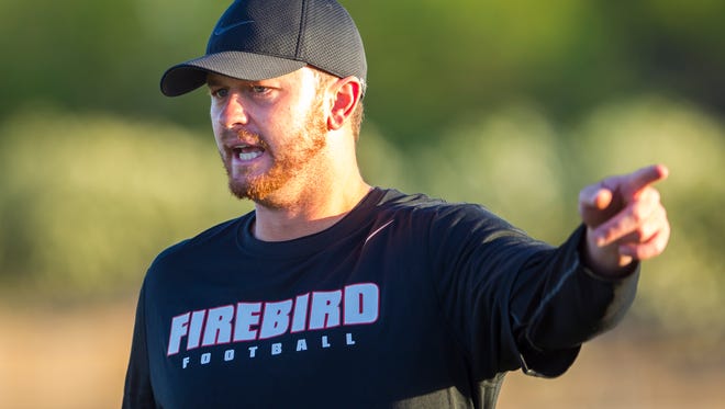 Chaparral High School's offensive coordinator Rudy Carpenter gives directions during spring football practice on May 13, 2014. Carpenter is the new quarterbacks coach at Coronado.