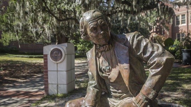 A statue of Francis Eppes sits in front of Westcott Building on FSU's campus.