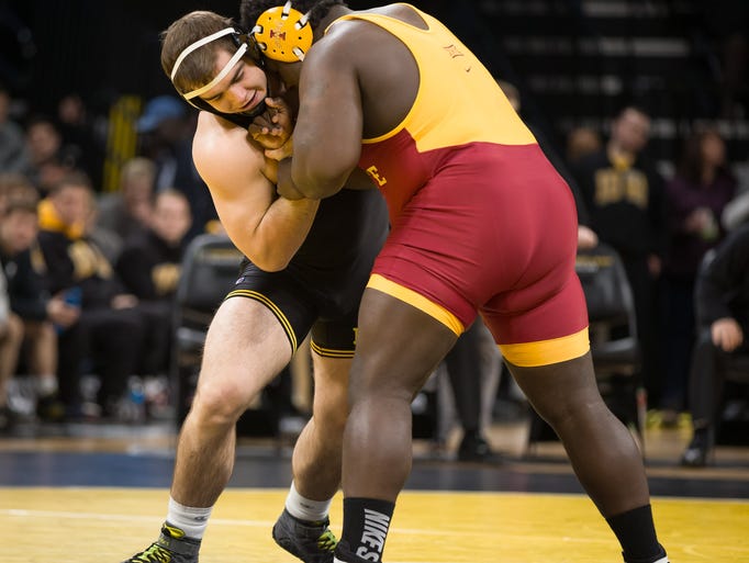 Iowa's Steven Holloway grapples with Iowa State's Quean