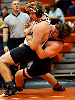 Zachary Matt of Valley wrestles Nathan Heath of ADM at 285 pounds Thursday at Valley High School. Valley won the dual 49-16. The Tigers then went on to a 36-25 victory over Dowling Catholic despite giving up four bonus-point wins.