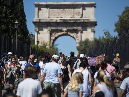 Tourists at the Colosseum on the eve of 'Ferragosto'