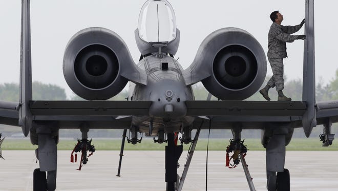 A ground crewsman prepares an A10  Thunderbolt II from the 107th Fighter Squadron for flight at Selfridge Air National Guard Base in Harrison Township on  May 8, 2012.