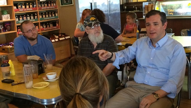 U.S. Sen. Ted Cruz, R-Texas, speaks to Smokey Row customers during a stop on Monday in Des Moines.