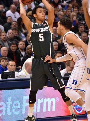 Michigan State's Bryn Forbes scored 18 in the team's opening game on its tour of Italy