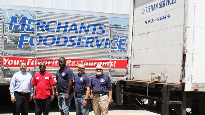 Merchants Foodservice has donated more than 1 million pounds of goods, a building and two semi-trailer trucks to Christian Services Inc., a charitable ministry operating near the company’s corporate office in Hattiesburg, since 1986. Pictured at a recent pickup at the corporate office are, from left, Andy Mercier, Merchants president and CEO; Curtis Frasier, Merchants delivery driver; Mario January, Christian Services driver; Jim Prout, Christian Services executive director; and Bill Prout, Christian Services founder.