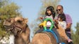 Chintaboina Ramprasad, of Tempe, rides a camel with