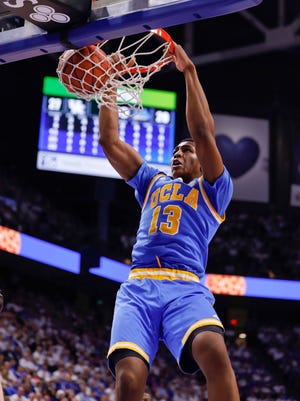 UCLA forward Ike Anigbogu dunks the ball in a win at Kentucky.