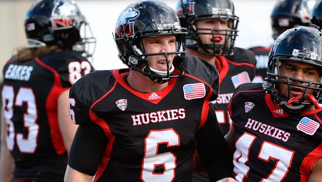 Northern Illinois quarterback Jordan Lynch (6) reacts after scoring a  touchdown against the Eastern Michigan during the first half Saturday at Huskie Stadium.