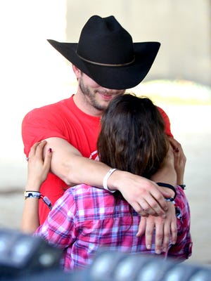 INDIO, CA - APRIL 25:  Actors Ashton Kutcher (L) and Mila Kunis attend day 1 of 2014 Stagecoach: California's Country Music Festival at the Empire Polo Club on April 25, 2014 in Indio, California.  (Photo by Frazer Harrison/Getty Images for Stagecoach)