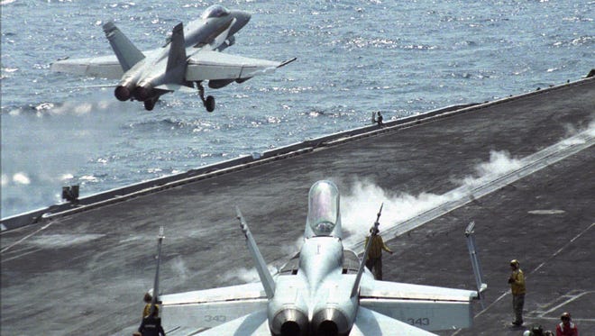An F-18 Hornet is catapulted from the USS Theodore Roosevelt in the Adriatic Sea on Sept. 4, 1995.