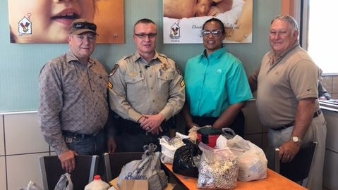 Pictured from left to right are Otero County Sheriff Benny House, Cpl. Theo Livingston, McDonald’s General Manager Barbra Good and Alamogordo’s McDonald’s franchise owner Malcolm Ramsey.