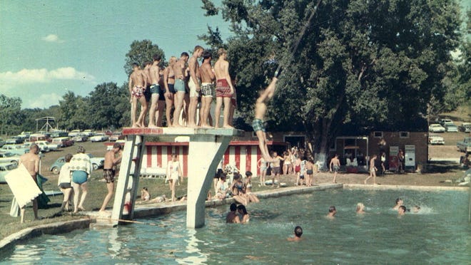 ABOVE: A diving platform still stands at Clear Creek pool. The water was 12-feet deep near the diving board.TOP: Trapeze swings were one of the major attractions at the pool at Clear Creek Park.