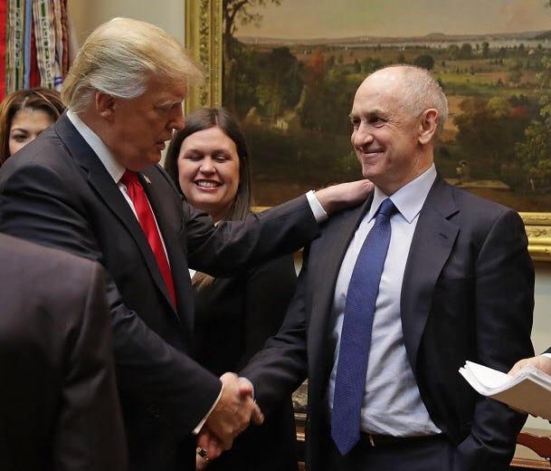 President Trump shakes hands with Chris Liddell on Jan. 30, 2017.