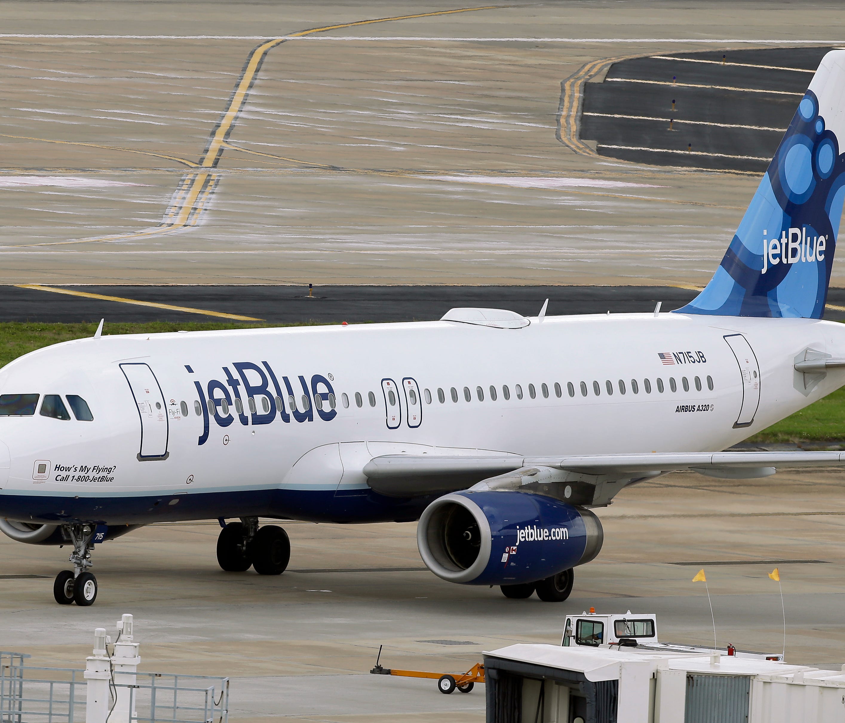 A JetBlue Airways Airbus A320-232 pushes back from the gate at Tampa International Airport on May 15, 2014.
