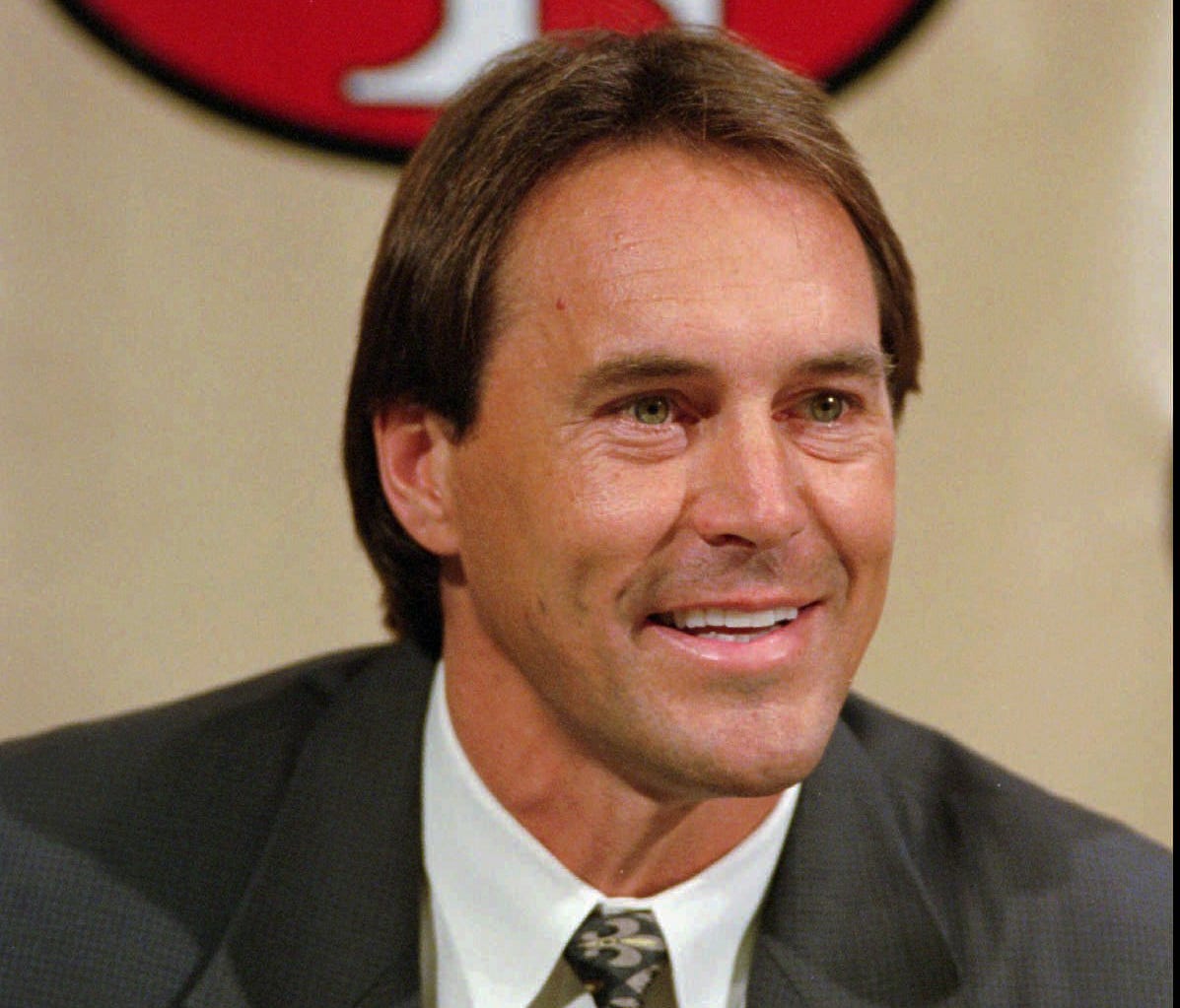 Former San Francisco 49ers executive Dwight Clark smiles during a news conference at the 49ers training camp in Santa Clara, Calif., Tuesday, Feb. 7, 1995.  Clark played nine seasons as wide receiver for the 49ers from 1979-1987.