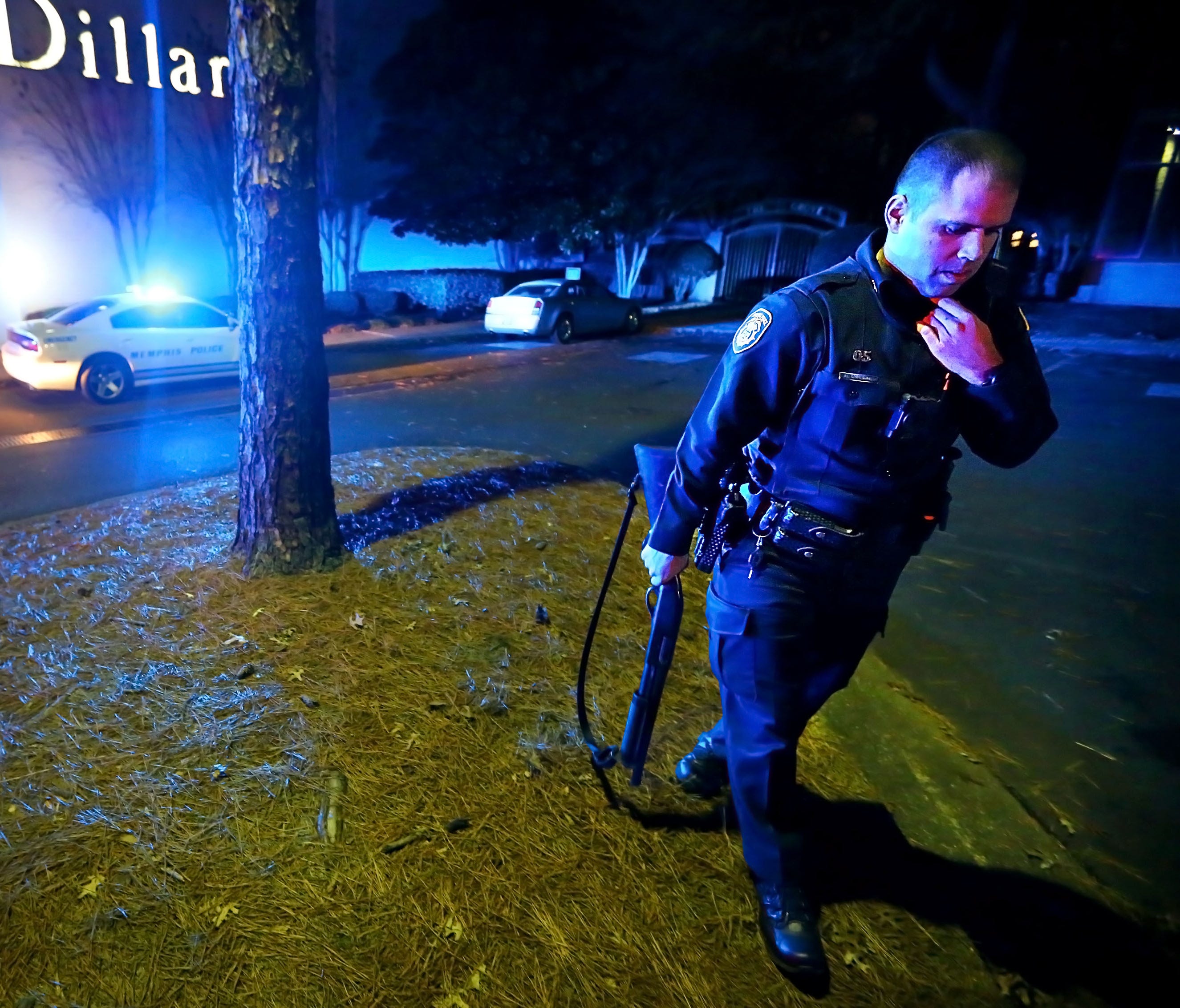 MPD officers block off the entrances to the Oak Court Mall Monday night after a disturbance in the food court sent patrons into a panic.