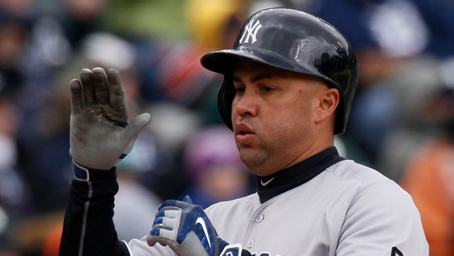 New York Yankees' Carlos Beltran comes home after hitting a home run against the Detroit Tigers during a baseball game Saturday, April 9, 2016, in Detroit.