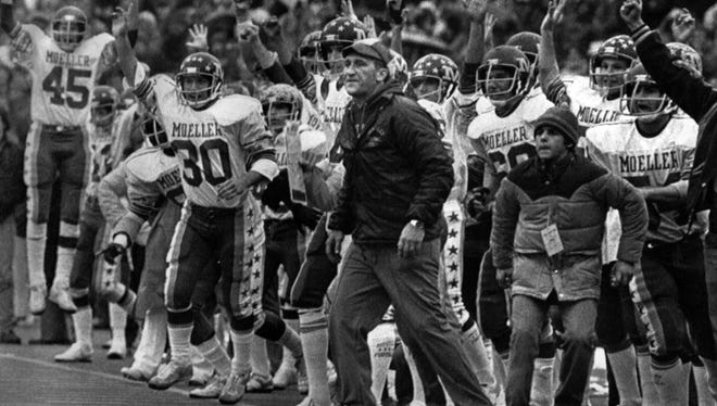 Moeller head coach Gerry Faust, center, cheers with the rest of the team as Mark Brooks scored his second touchdown in the Ohio high school championship game with Massillon in November 1980. Moeller won the game 30-7.