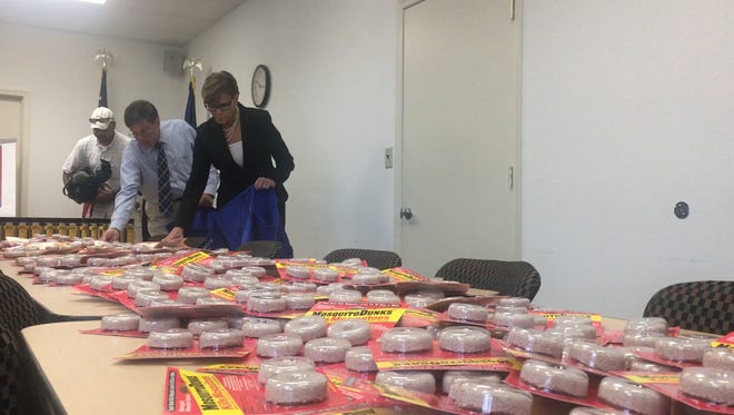 Dr. Karen Murphy, secretary of the Department of Health, packs up Zika prevention kits to be distributed around Pennsylvania. (Katherine Ranzenberger photo)