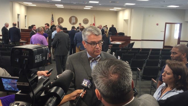 Jackson Sharmon, who has been appointed to lead the investigation into Gov. Robert Bentley's possible impeachment, answers questions from reporters following his appointment.