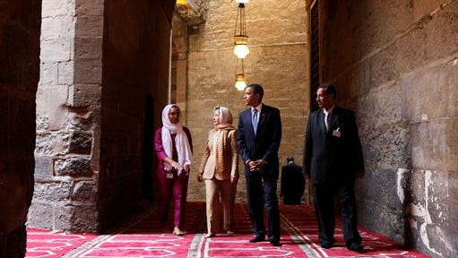 FILE - In this Thursday, June 4, 2009 file photo, U.S. President Barack Obama, 2nd right, tours the Sultan Hassan Mosque in Cairo, Egypt, with U.S. Secretary of State Hillary Rodham Clinton, 2nd left,  Iman Abdel Fateh at left and Dr. Zahi Hawass, right. Obama's first visit to a U.S. mosque comes as Muslim-Americans say they're confronting increasing levels of bias in speech and deeds. Obama is scheduled to visit the Islamic Society of Baltimore on Wednesday, Feb. 3, 2016. (AP Photo/Gerald Herbert, File)