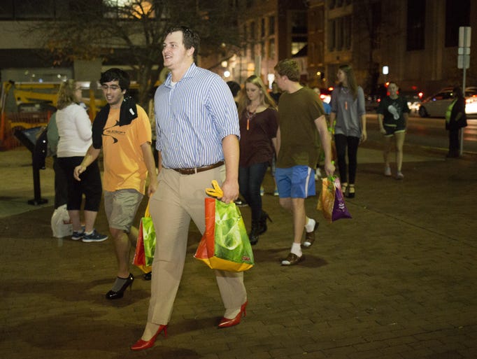 Jason Sneeringer, of York Township, center, takes part