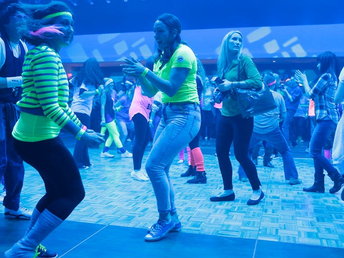 The crowd competes in a dance competition during the