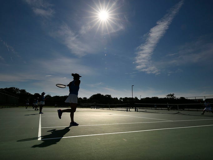Nicolet Number One Doubles Player Elise Gerard warms