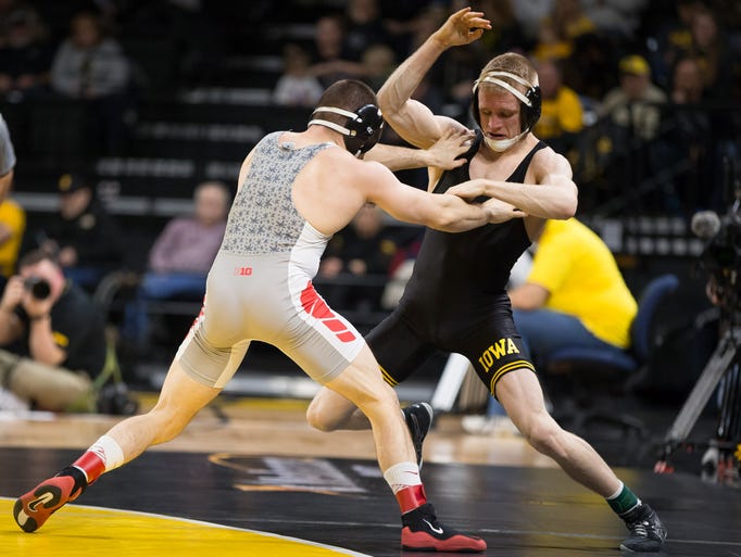 Iowa junior Phillip Laux is pushed out by Ohio State