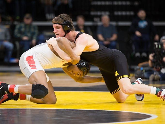 Iowa senior Sammy Brooks grapples with Ohio State sophomore