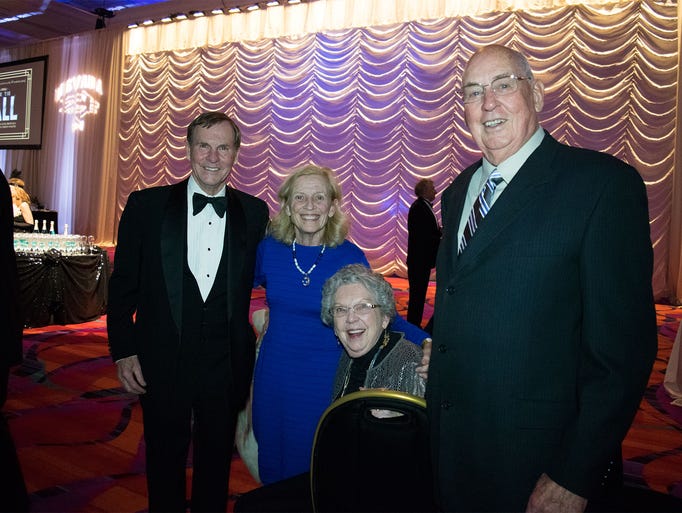 Guests attend the 8th Annual Blue Tie Ball on Friday,