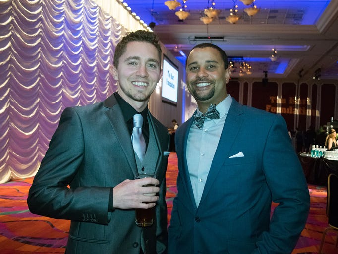 Guests attend the 8th Annual Blue Tie Ball on Friday,