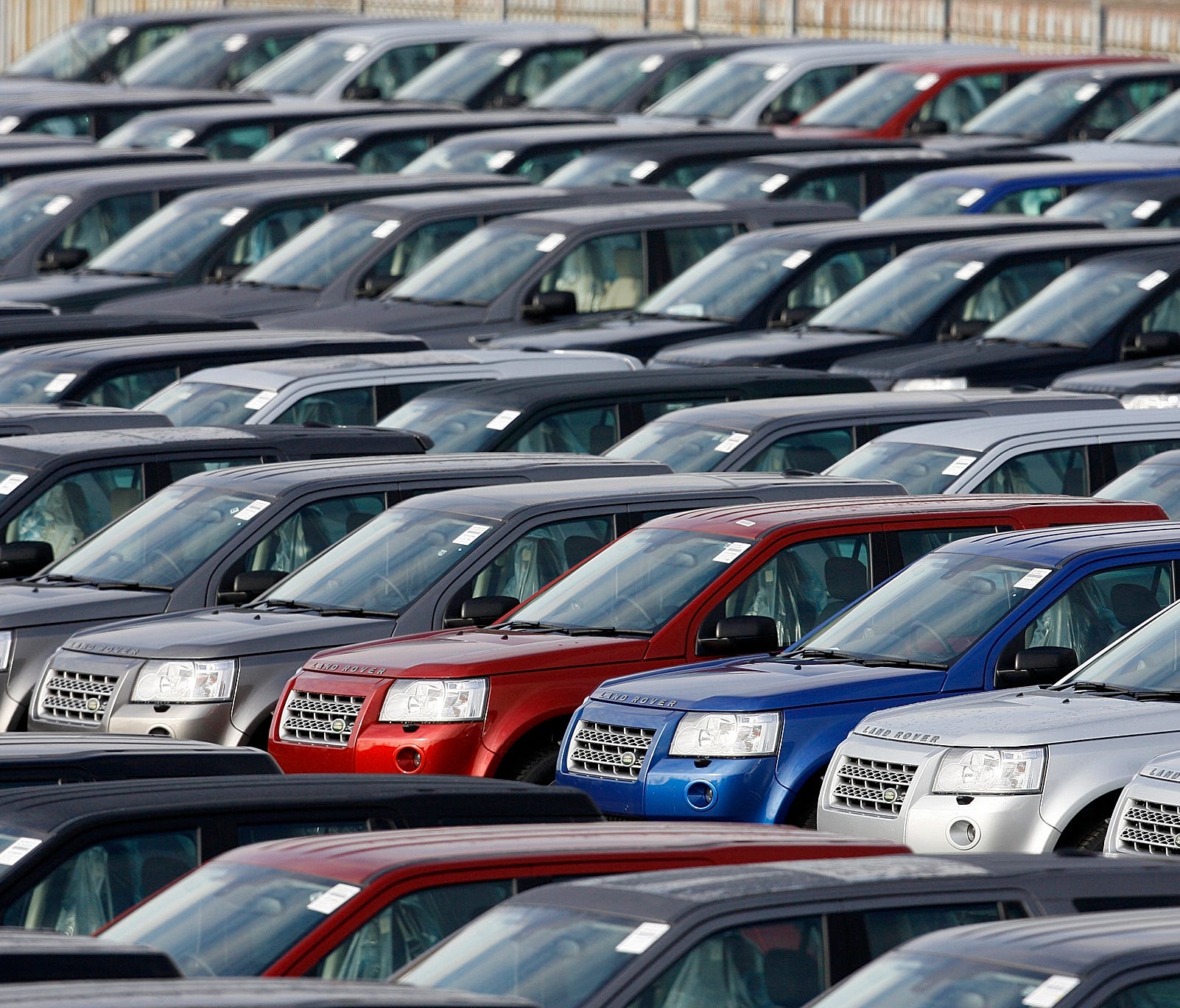 In this Friday Feb. 20, 2009 file photo, new Land Rover Freelander vehicles are stockpiled outside the Jaguar and Land Rover factory in Halewood, Liverpool, England. The British car industry association said Friday Jan. 5, 2017, that automobile sales