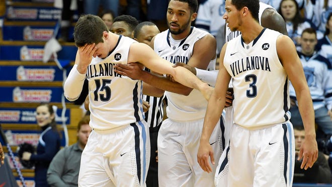 Villanova Wildcats guard Ryan Arcidiacono holds his head after being struck with a forearm by Seton Hall's Sterling Gibbs on Monday night.