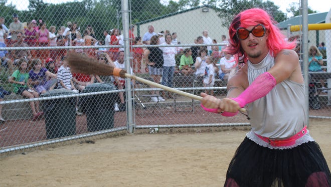 Carl Idler, dressed as Lady Gaga, opted for a broom instead of a bat when taking a practice swing at a past Delhi Skirt Game. Delhi Township officials have said they want to scrap the cross-dressing part of the annual charity event.