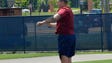 Michigan offensive lineman Mason Cole heads a ball