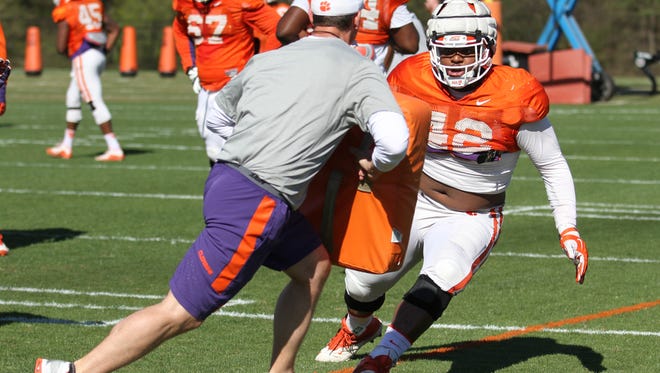 Clemson's Christian Wilkins (42) participates in a drill during spring practice. Wilkins will start up front defensively for the Tigers, although it remains uncertain whether he'll be at end or tackle.