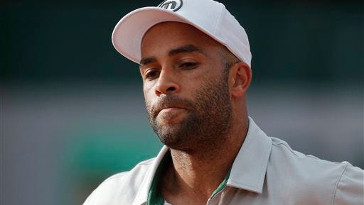 FILE - In this May 26, 2013, file photo, James Blake grimaces after missing a return against Serbia's Viktor Troicki at the French Open tennis tournament in Paris. Internal affairs detectives are investigating claims by former tennis professional James Blake that he was thrown to the ground and then handcuffed while mistakenly being arrested Wednesday, Sept. 9, 2015, at a New York hotel, police said. Blake, who's biracial, told the Daily News he wasn't sure if he was arrested because of his race but said the officer who put him in handcuffs inappropriately used force. (AP Photo/Michel Spingler, File)