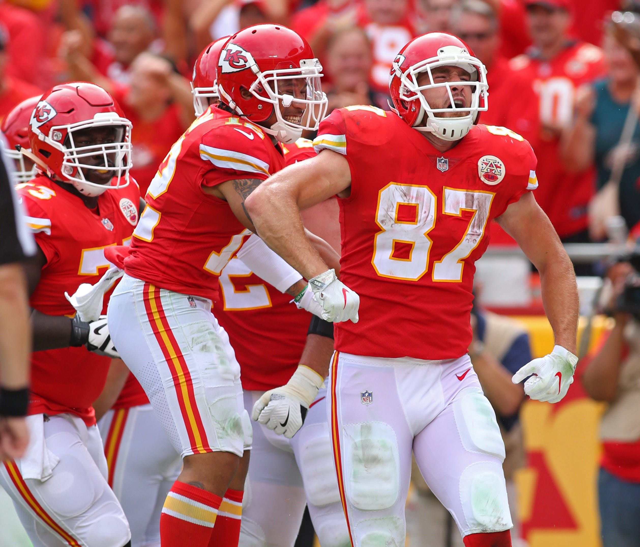 Kansas City Chiefs tight end Travis Kelce (87) celebrates after scoring a touchdown against the Philadelphia Eagles in the second half at Arrowhead Stadium.