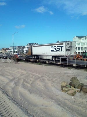 In this Wednesday, Sept. 20, 2017 photo, a tractor trailer is shown stuck on the boardwalk in Ventnor, N.J.