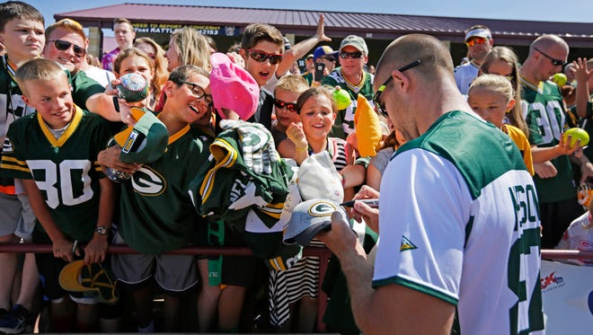 Jordy Nelson signs autographs following the Jordy Nelson Charity Softball Game at Neuroscience Group Field at Fox Cities Stadium.