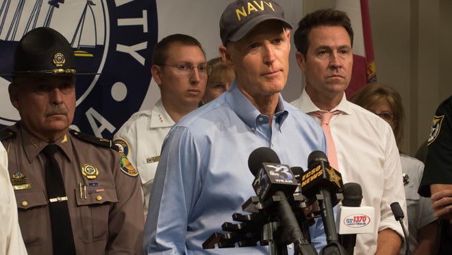 Governor Rick Scott speaks with members of the media after a weather briefing at the Escambia County Emergency Operations Center Friday, Oct. 6, 2017.