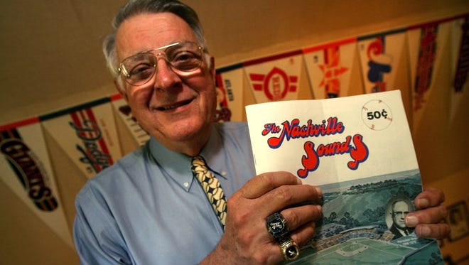 Larry Schmittou, shown on July 7, 2006, was recognized by Baseball America as one of 25 individuals whom they feel have made the most significant contributions to baseball in the past 25 years. He is holding the program from the Sounds' first season and wears two championship rings from the team for 1982 and 1979. -