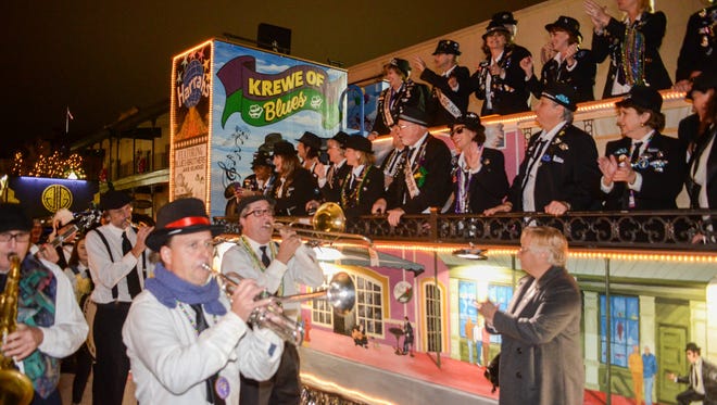 Members of the Krewe of Blues receive the blessings of the season as Pensacola Mardi Gras festivities begin at the annual Pensacola Mardi Gras Kick Off Celebration in downtown Pensacola.