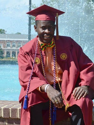 Elisson Adrien of Haiti graduated from Elon University May 20.