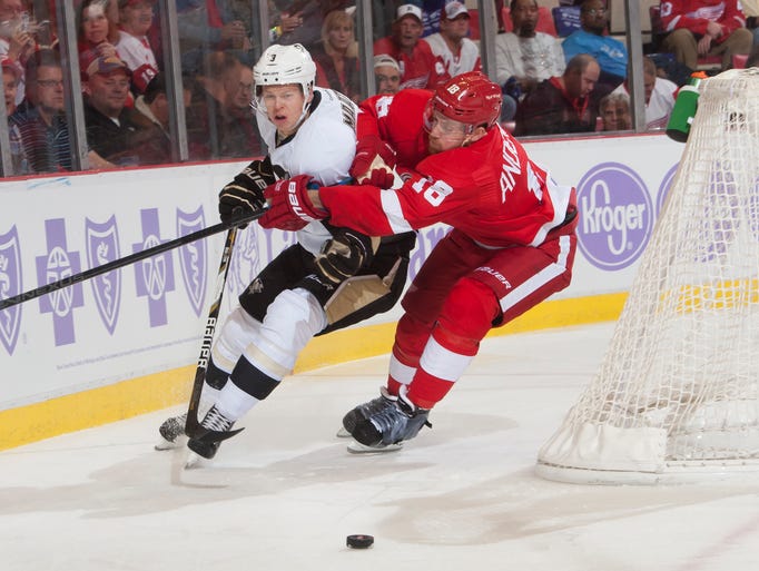 Red Wings center Joakim Andersson and Penguins defenseman