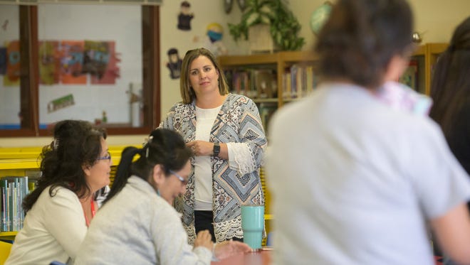 Apache Elementary School Principal Jennifer Bowles talks with parents about the school's Navajo dual language immersion program on Monday in Farmington.