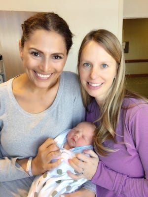 Rachel Maciejewski (right), a nurse from Sussex, was a surrogate who carried the baby, Elyssa Rose, of Sally Obermeder, an Australian TV personality who because of cancer was urged not to become pregnant.
