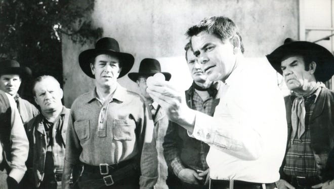 Glenn Ford demonstrates his shooting in 'The Fastest Gun Alive'
