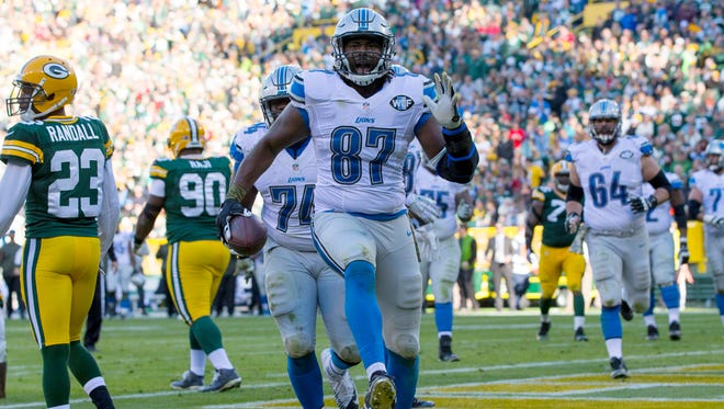 Lions tight end Brandon Pettigrew (87) celebrates a touchdown catch during the third quarter of the win over the Packers Sunday in Green Bay, Wis.